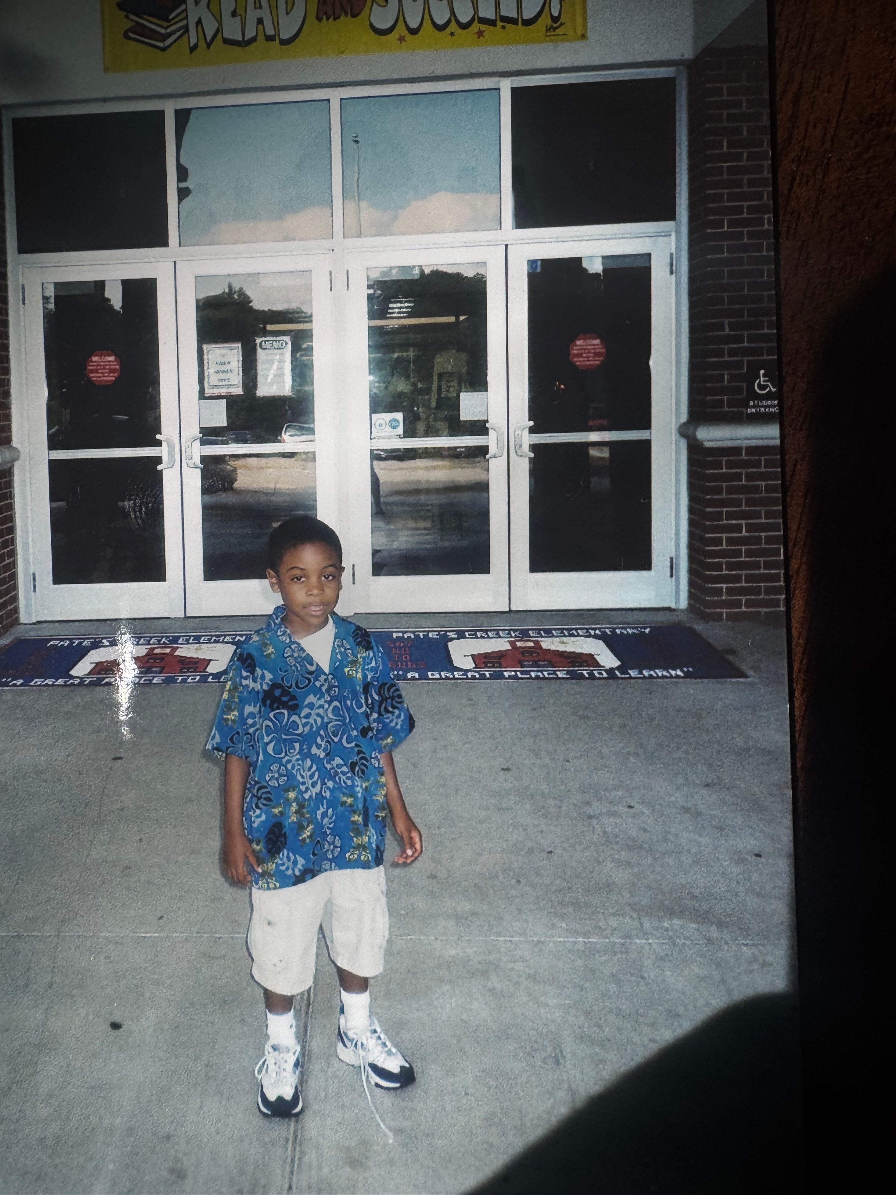 Young Anthony Wilson standing outside his Atlanta elementary school